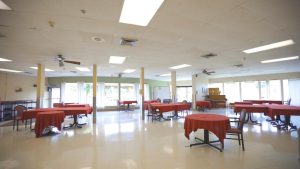 Dining hall with red dining tables with chairs